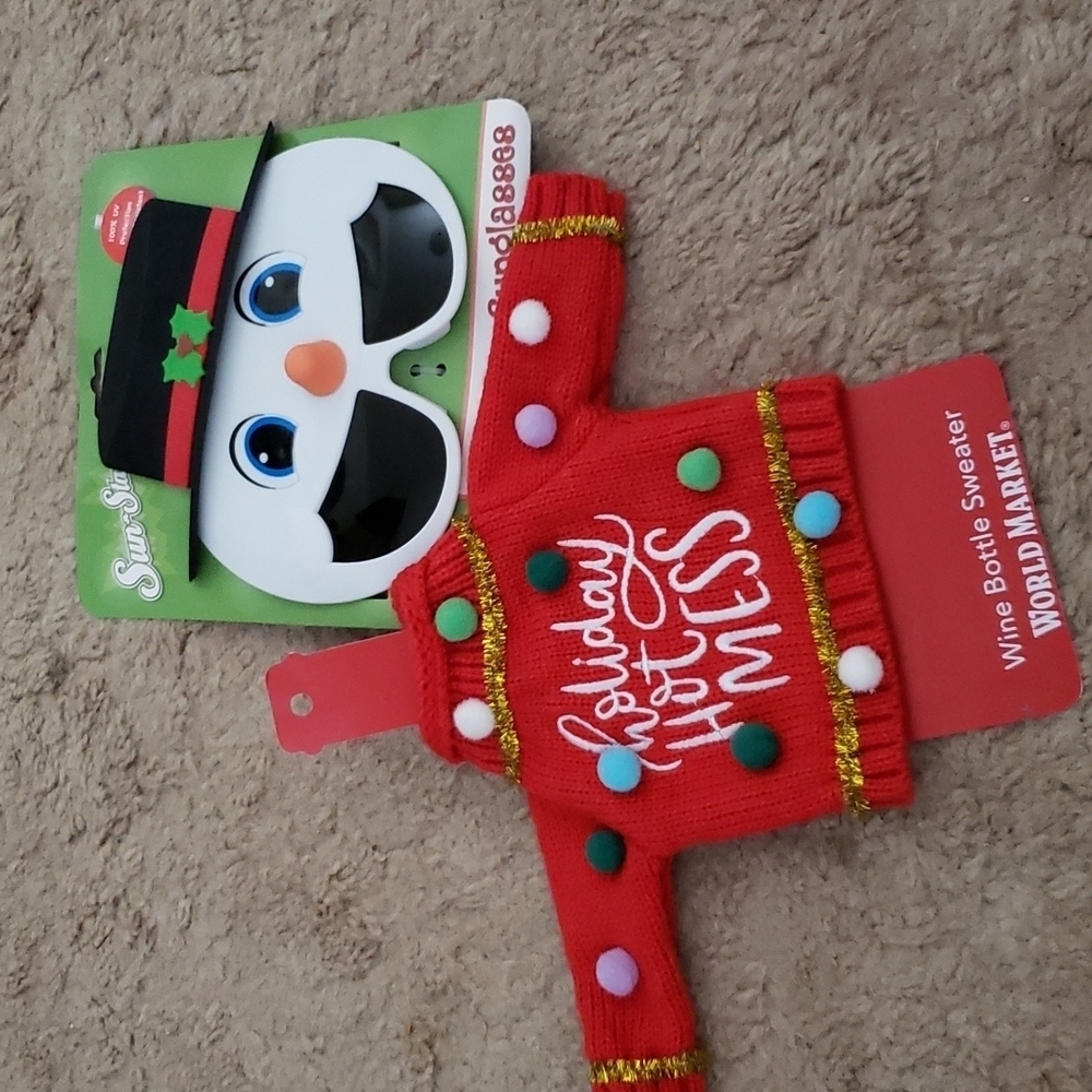 Christmas accessories. Snowman sunglasses and sweater for wine bottle.